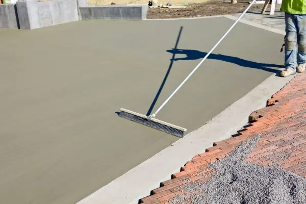 Concrete Worker Resurfacing New Concrete Patio