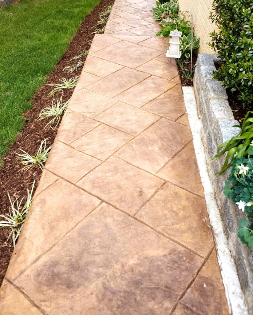 stamped concrete sidewalk with beautiful landscapes